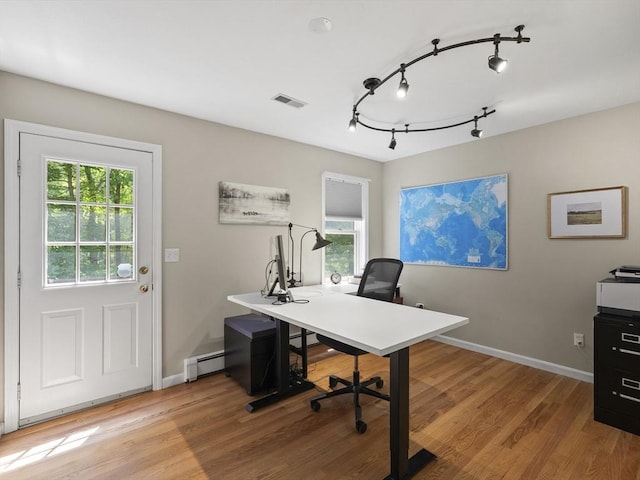200 Newtown Rd, Acton, MA 01720 - office area with a baseboard radiator, wood finished floors, plenty of natural light, and track lighting