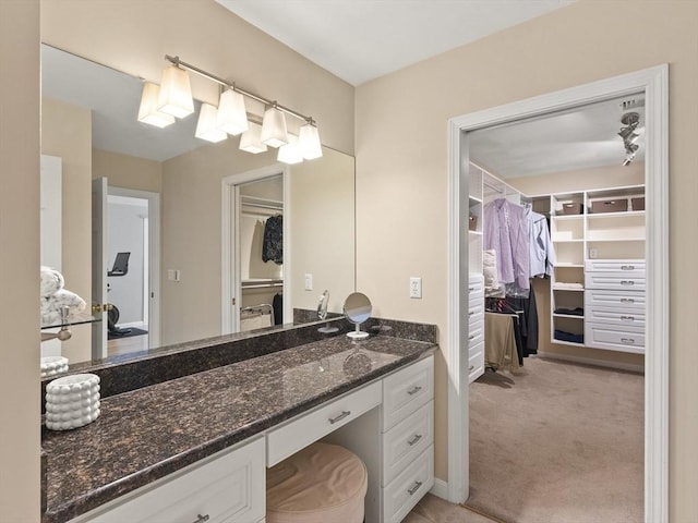 200 Newtown Rd, Acton, MA 01720 - bathroom with a walk in closet and vanity