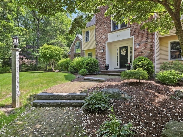 200 Newtown Rd, Acton, MA 01720 - view of front facade featuring a front lawn and brick siding