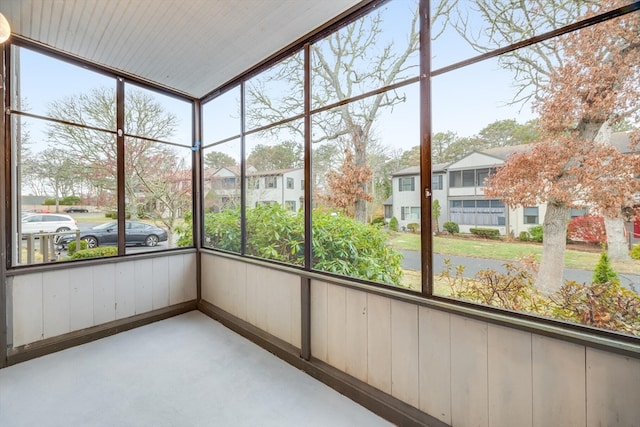 unfurnished sunroom featuring plenty of natural light