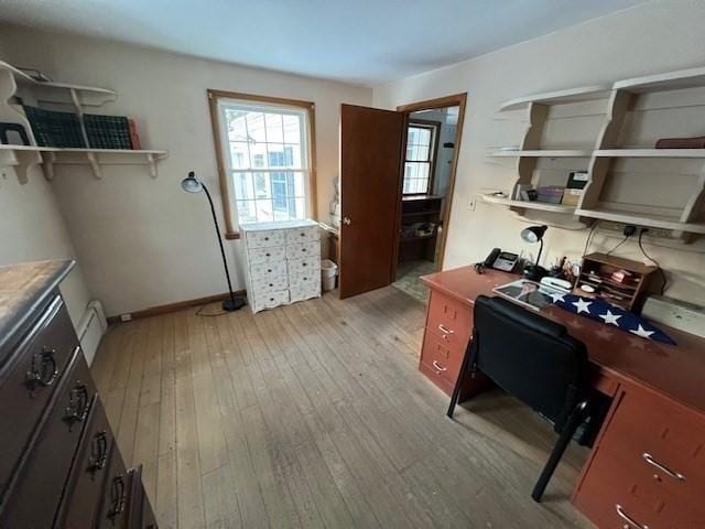 office space with light wood-type flooring