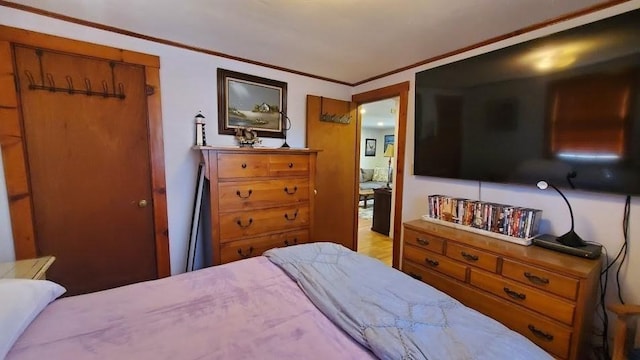 bedroom with crown molding