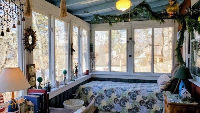 sunroom / solarium with wood ceiling and vaulted ceiling with beams