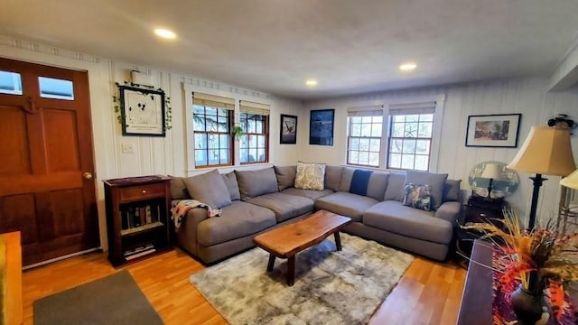 living room with plenty of natural light, recessed lighting, and light wood-type flooring