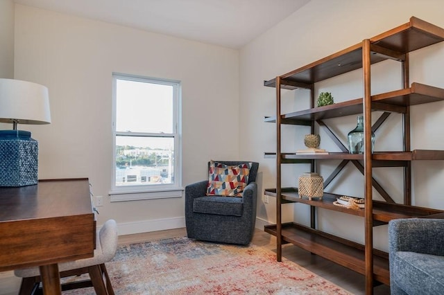 sitting room featuring wood finished floors and baseboards