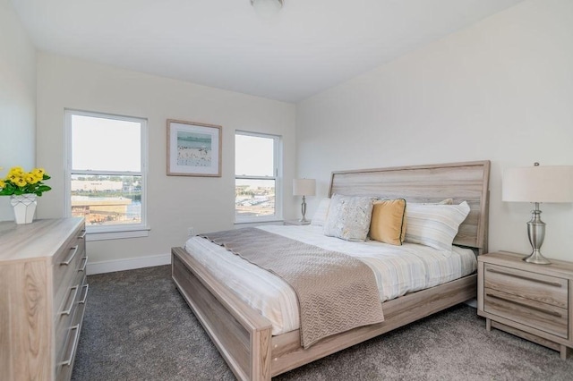 bedroom featuring carpet flooring and baseboards