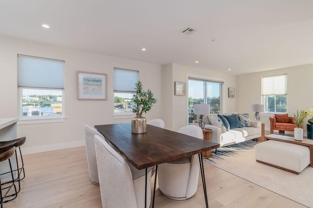 dining space featuring baseboards, recessed lighting, visible vents, and light wood-style floors