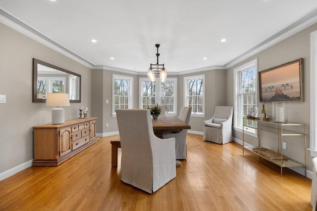 dining room with recessed lighting, baseboards, ornamental molding, and light wood-style floors