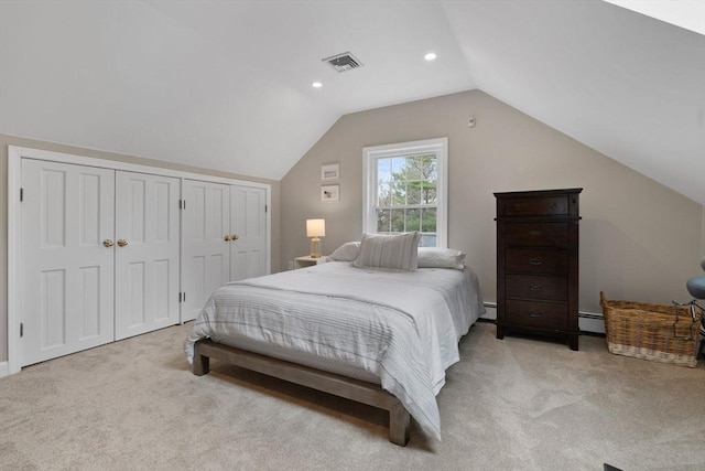 bedroom with visible vents, recessed lighting, lofted ceiling, and light carpet