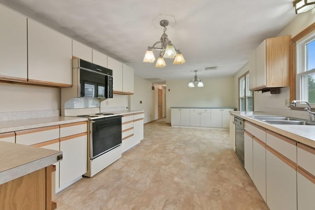 kitchen with electric range, a notable chandelier, hanging light fixtures, a sink, and black microwave