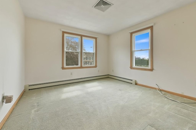 carpeted empty room with baseboards and visible vents