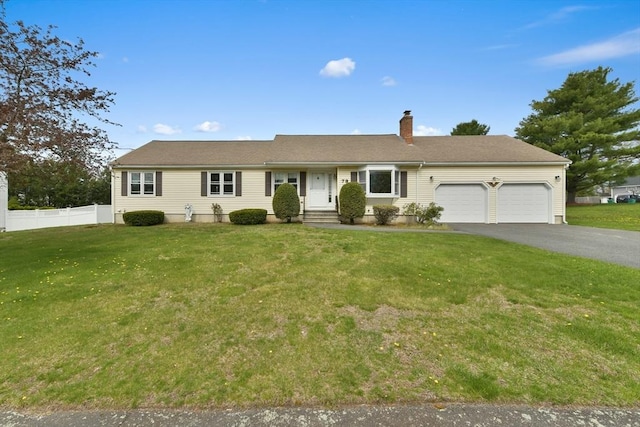 ranch-style house featuring a chimney, a front yard, a garage, fence, and aphalt driveway
