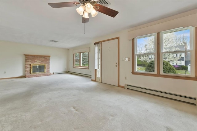 unfurnished living room with baseboard heating, a fireplace, carpet floors, a ceiling fan, and a baseboard heating unit