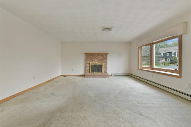 unfurnished living room featuring carpet flooring, a fireplace, baseboards, a baseboard radiator, and visible vents