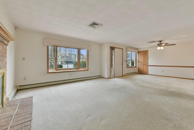 unfurnished living room featuring visible vents, baseboard heating, light colored carpet, a baseboard heating unit, and a ceiling fan