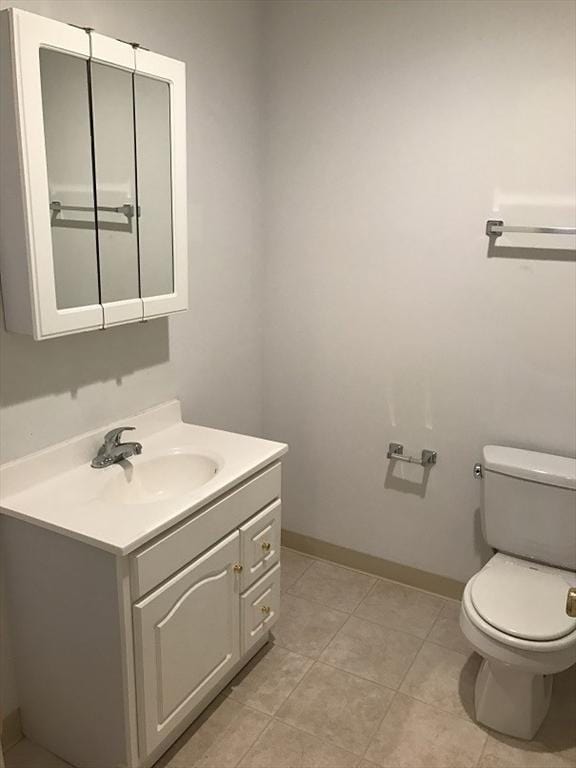 531 Main St Unit 203, Worcester, MA 01608 - bathroom with toilet, vanity, baseboards, and tile patterned floors