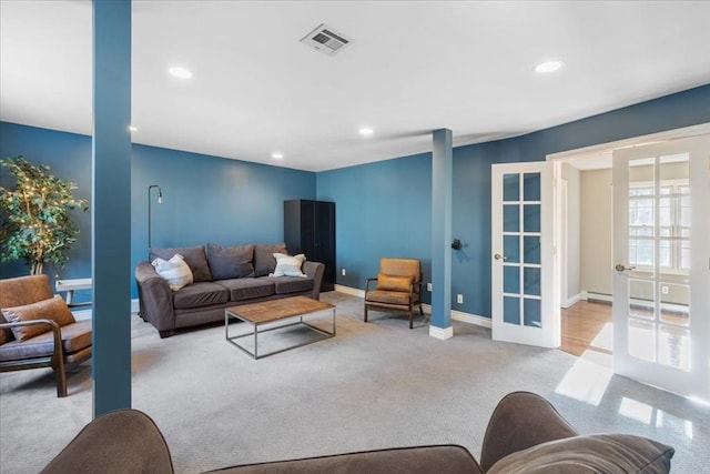 carpeted living room with french doors