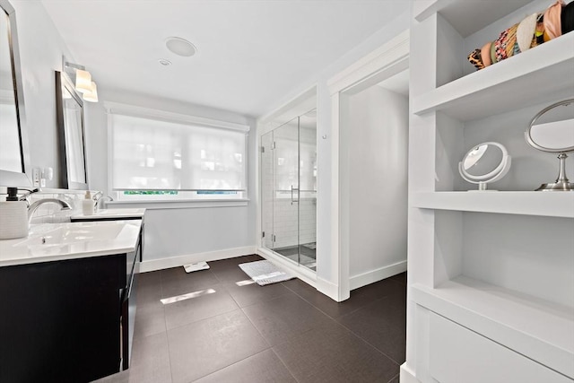 141 Cornell St, Newton, MA 02462 - bathroom with a shower stall, double vanity, and tile patterned flooring