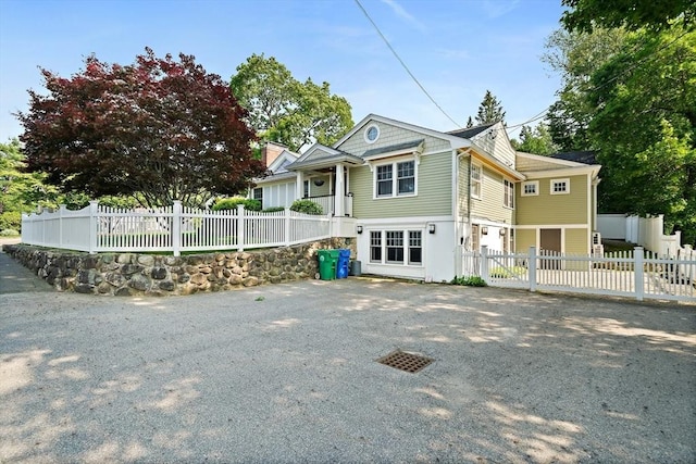 141 Cornell St, Newton, MA 02462 - view of front facade featuring a fenced front yard