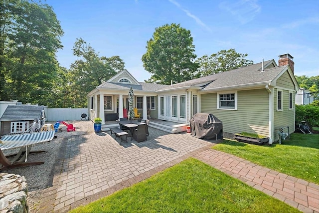141 Cornell St, Newton, MA 02462 - rear view of property with a chimney, a patio, and a shingled roof