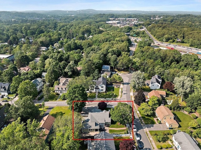 141 Cornell St, Newton, MA 02462 - aerial perspective of suburban area featuring a heavily wooded area and property parcel outlined
