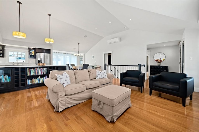 141 Cornell St, Newton, MA 02462 - living area featuring a wall unit AC, light wood-style floors, vaulted ceiling, and a chandelier