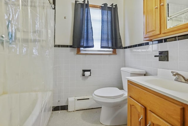 full bathroom featuring toilet, tile walls, baseboard heating, vanity, and shower / bath combo