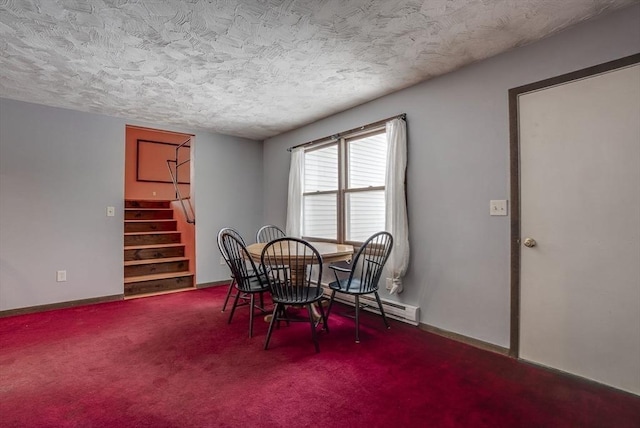 dining room with a textured ceiling and carpet flooring