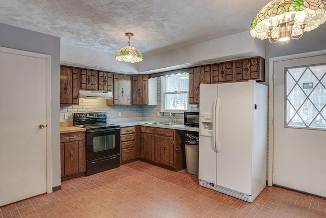 kitchen featuring white fridge with ice dispenser, decorative light fixtures, sink, tasteful backsplash, and black range with electric cooktop