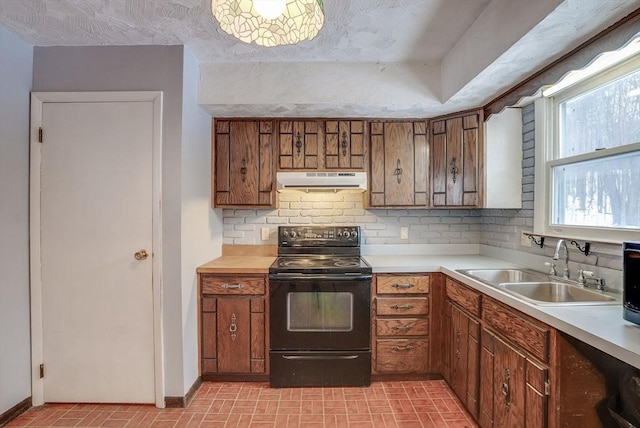 kitchen with sink, backsplash, and black range with electric cooktop