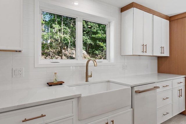122 Charles St, Reading, MA 01867 - kitchen with a sink, white dishwasher, plenty of natural light, and light countertops