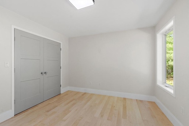 122 Charles St, Reading, MA 01867 - unfurnished room with light wood-style flooring and baseboards