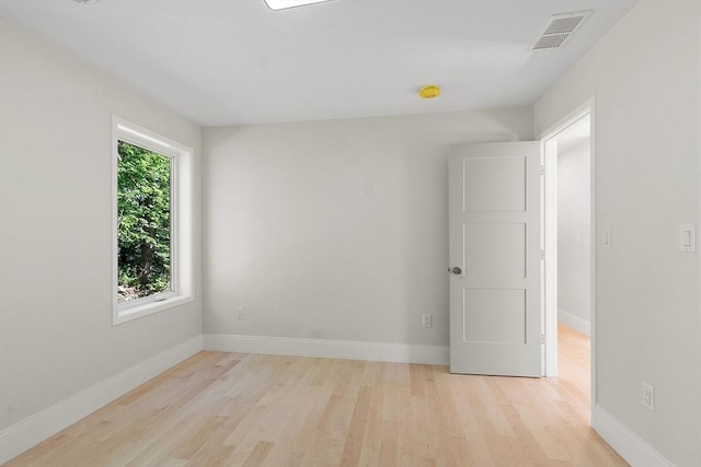 122 Charles St, Reading, MA 01867 - spare room with light wood-style flooring, baseboards, and a smoke detector