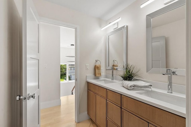 122 Charles St, Reading, MA 01867 - full bath featuring double vanity and baseboards