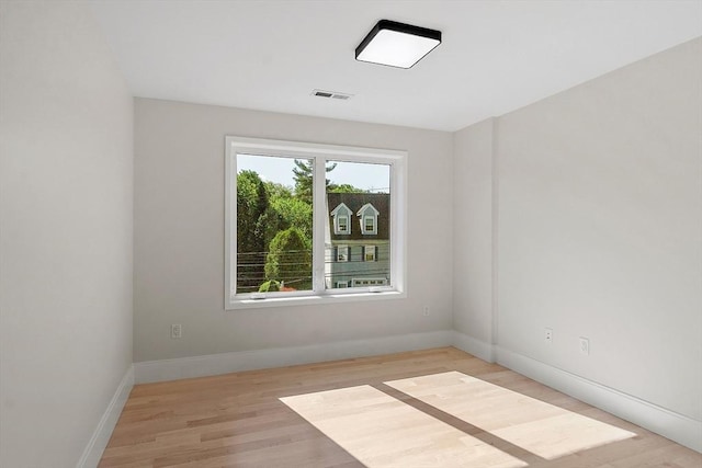 122 Charles St, Reading, MA 01867 - spare room with light wood-style floors and baseboards
