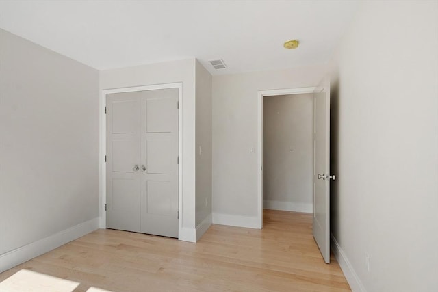 122 Charles St, Reading, MA 01867 - unfurnished bedroom with light wood-type flooring and baseboards