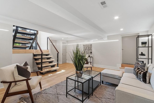122 Charles St, Reading, MA 01867 - living area featuring stairway, light wood-type flooring, baseboards, and recessed lighting