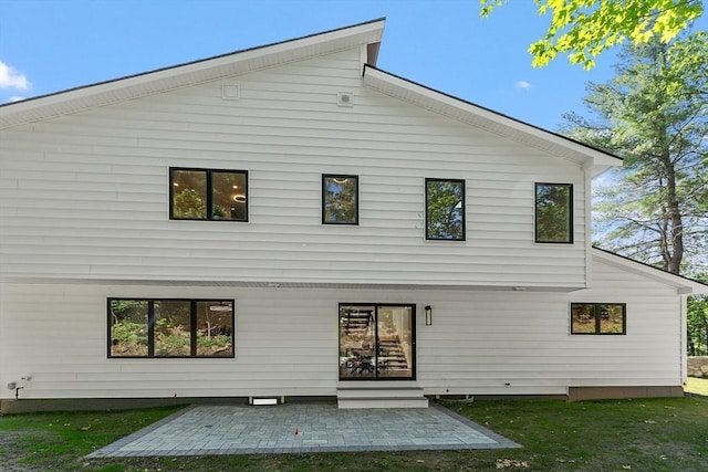 122 Charles St, Reading, MA 01867 - rear view of property featuring a patio