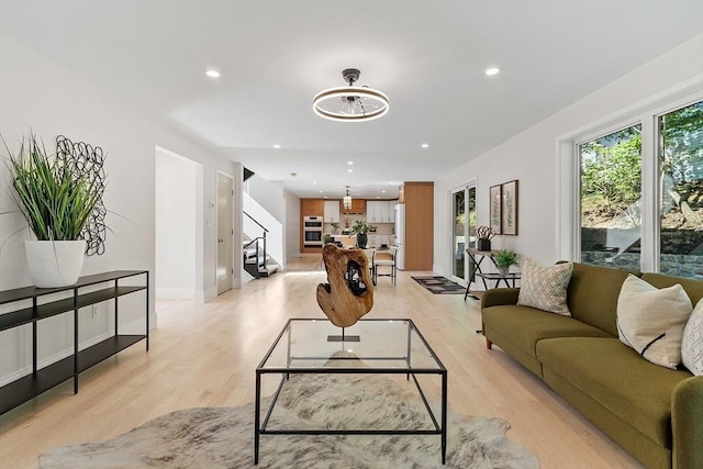 122 Charles St, Reading, MA 01867 - living room featuring recessed lighting, light wood-style flooring, and baseboards
