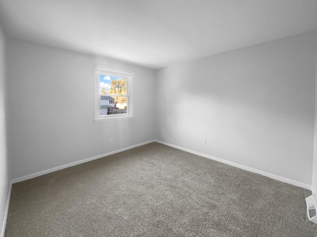 unfurnished room featuring carpet