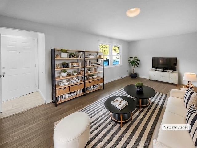 living room with dark hardwood / wood-style floors