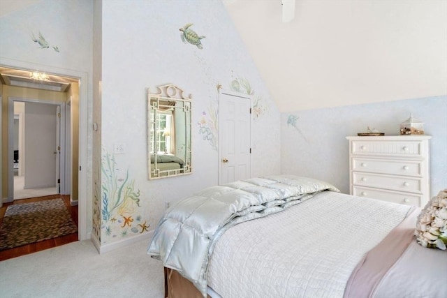 bedroom featuring baseboards, high vaulted ceiling, and light carpet