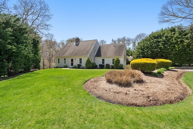 view of property exterior with a chimney and a yard