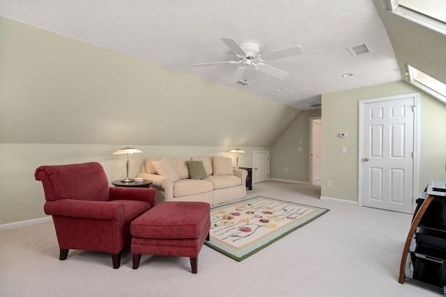 carpeted living area featuring vaulted ceiling, baseboards, a ceiling fan, and visible vents