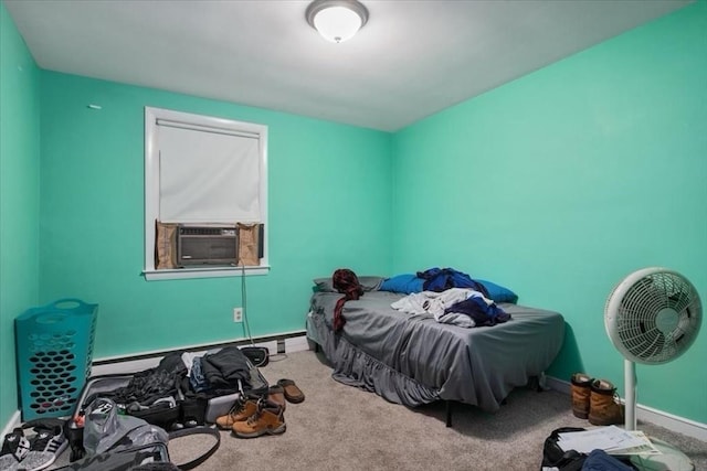 bedroom featuring carpet, baseboard heating, and cooling unit