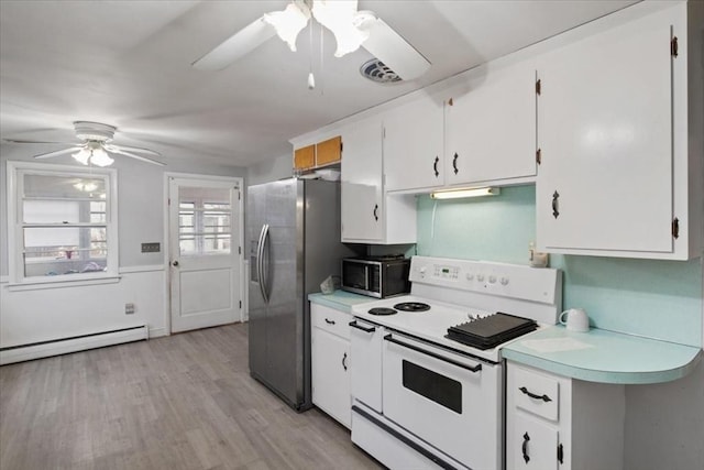 kitchen featuring baseboard heating, white range with electric stovetop, stainless steel fridge, white cabinets, and light wood-type flooring