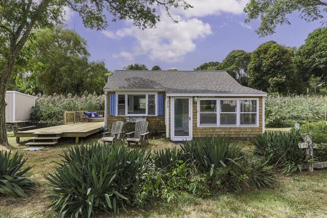 view of front of property featuring a wooden deck