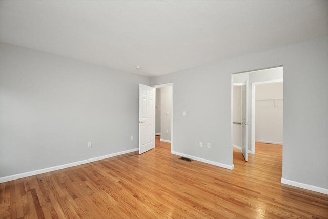 spare room with light wood-type flooring