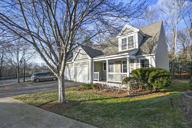 cape cod-style house with a porch, a garage, and a front yard