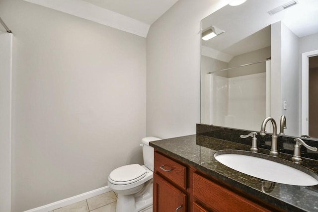 bathroom with tile patterned flooring, vaulted ceiling, toilet, vanity, and a shower